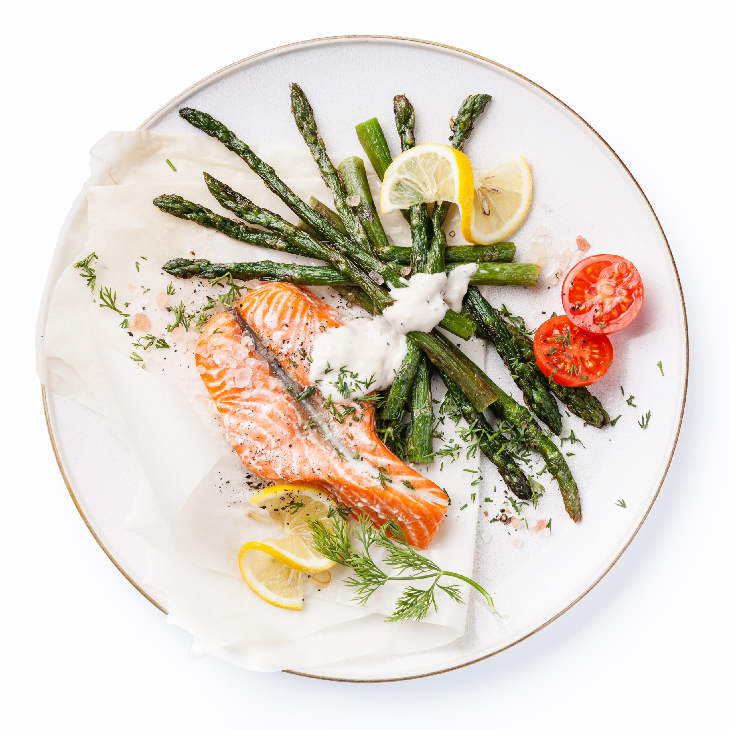 Grilled salmon with asparagus isolated on white background